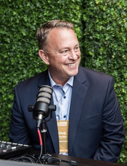 W. Chris Green at the microphone — hospitality keynote speaker